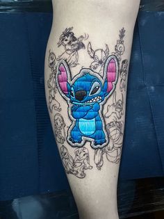 a tattoo on the leg of a person with an image of stitching stitchs