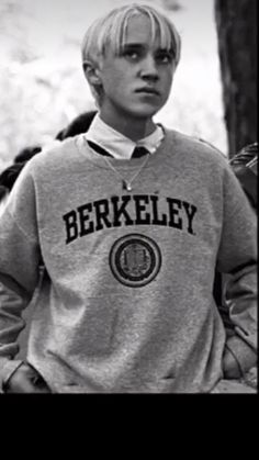 black and white photograph of young boy with blonde hair wearing a berkley sweatshirt