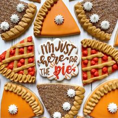 decorated cookies arranged in the shape of pies and pie slices with words that read, i'm just here for the pie