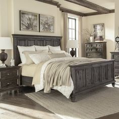 a bedroom scene with focus on the bed and dresser