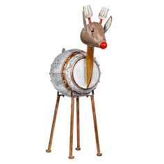 a metal and wood deer with red nose on top of a barrel shaped object in front of a white background