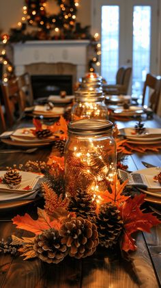 a dining room table is set for christmas with pine cones and lights on the tables