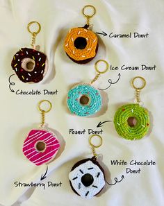 six different types of doughnuts are shown on a white sheet with gold chains