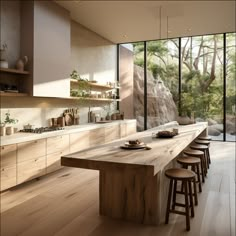 a large wooden table sitting in the middle of a kitchen with lots of counter space