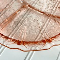 an empty glass plate sitting on top of a table