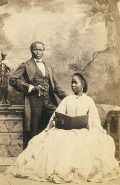 an old black and white photo of a family posing for a picture in the early 1900's