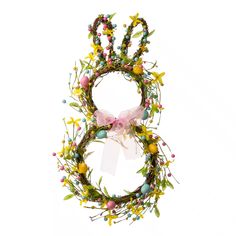 an easter wreath with bunny ears and flowers