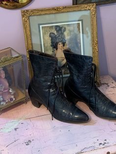 Antique black leather boots that lace up in front.  Considering their age they are in very good condition with slight scuffing in a few small areas from general wear.  There is a label inside and also numbers stamped on the sides.  These make a great display piece.  Please refer to all photos, selling as found.  All shipping overages will be refunded. Vintage Black Lace-up Boots, Vintage Lace-up Leather Boots, Vintage Black Lace-up Heeled Boots, Vintage Ankle Lace-up Boots For Fall, Vintage Black Lace-up Winter Boots, Vintage Black Lace-up Ankle Boots, Vintage Black Lace-up Boots For Winter, Vintage Black Ankle Lace-up Boots, Vintage High-top Lace-up Boots With Leather Sole