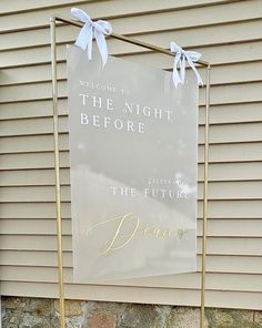 a sign that says welcome to the night before the future is born in front of a house