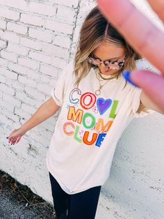 you asked and we delivered !! 💕🦋  let's just take moment here -- very own etta original cool mom club graphic tee.  ivory comfort colors tee loose fitting  UNISEX FIT Kendra's tts in tees is a m/l kendra is in XL here We always recommend sizing up in graphics  Sloan would get xl for denim styled but xx for comfort in leggings  50% cotton 50% polyester  do nottttttt size up if you don't like this super oversized! SO SO CUTE *will take 2-4 business days to fulfill due to the influx of orders -- thank YOU for being patient* Cool Moms Club, Cool Mom, Moms Club, Comfort Colors Tee, Cami Tanks, Denim Pant, Best Mom, Hat Hairstyles, Sales Gifts