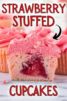 strawberry stuffed cupcakes with pink frosting on top