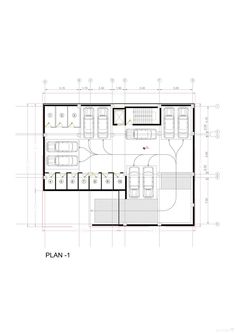 the floor plan for an office building with two floors and three cars parked in it