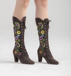 "The most beautiful handmade suede embroidered boots in the 1960s Jerry Edouard vintage \"Almost Famous\" style. In a fine muted brown suede color which is perfect for today's palettes. Has a scroll of embroidered flowers and leaves made of multicolored orange, yellow, blue, green, purple, and pink thread on both sides of the boot. Have blue and yellow beading on the flowers. Lace all the way up in fine chrome eyes and hooks. Tapered toe and Cuban heel. Our own label. These have braided laces th Bohemian Boots With Floral Embroidery For Fall, Bohemian Fall Boots With Floral Embroidery, Bohemian Floral Embroidered Boots For Fall, Traditional Brown Boots For Spring, Brown Bohemian Embroidered Boots, Vintage Embroidered Boots For Fall, Vintage Embroidered Fall Boots, 1960s Boots, Whimsical Shoes