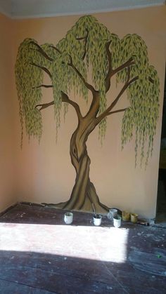 a tree painted on the side of a wall