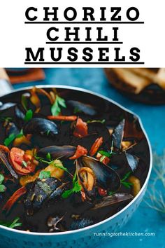 a pan filled with cooked mussels and garnished with parsley on the side