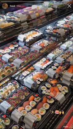 an assortment of sushi on display in a grocery store with the price tag below