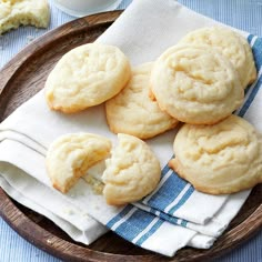 some cookies are on a plate with a blue and white towel