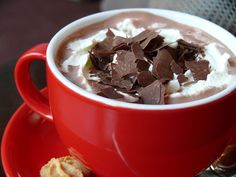 a red cup filled with hot chocolate and marshmallows