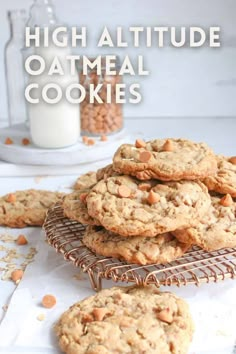 high altitude oatmeal cookies on a cooling rack with milk in the background