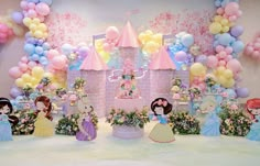 a birthday party with princess decorations and balloons