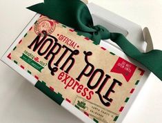 the north pole express box is wrapped in green ribbon