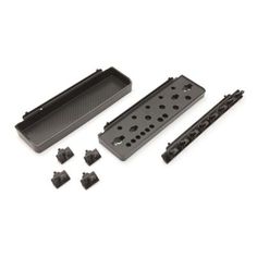 an assortment of black plastic parts on a white background