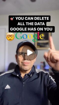 a man in a black jacket pointing at the camera with google's message above his head