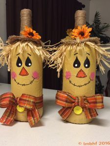 two scarecrows made out of toilet paper