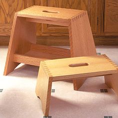 two wooden step stools sitting on the floor