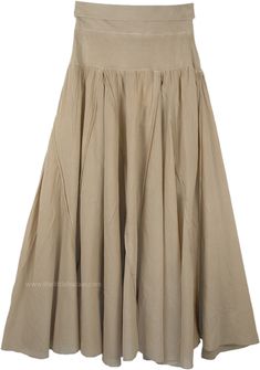 This flexible yoga waistband skirt in beige features an ankle length and full silhouette and it is stitched in vertical tiers giving the skirt an easy-going flow. This style hugs your hips beautifully and then the vertical tiers flow down to give the fullness and sway as you walk. This style is easy to wear, unique and good on most body types. A hybrid of femininity and sportswear is appropriate for both the office and vacation. It is great for a change from pants on hot summer nights. Still cas Beige Long Cotton Skirt, Bohemian Beige Flowy Skirt, Beige Bohemian Relaxed Maxi Skirt, Flowy Cotton Brown Skirt, Vintage Beige Cotton Skirt, Work Wear Office, Long Cotton Skirt, Stylish Office Wear, Summer Office Wear