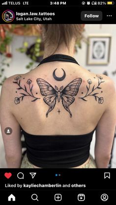 a woman with a butterfly tattoo on her back