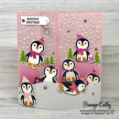 a card with penguins and snowflakes on it