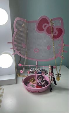 a hello kitty jewelry holder on a table