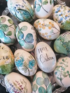 there are many painted eggs with flowers on them