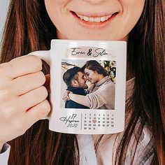 a woman holding a coffee mug with a photo on it