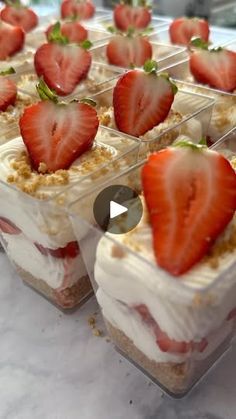 several desserts with strawberries are arranged in rows