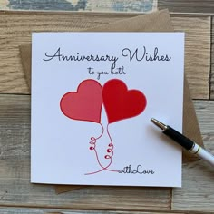 an anniversary card with two hearts on it