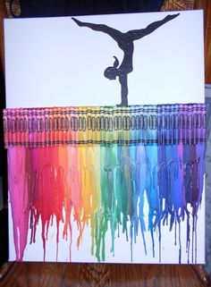 an image of a person doing gymnastics with paint on the floor and in front of them