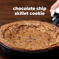 a chocolate chip skillet cookie in a cast iron pan