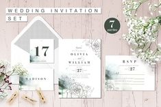 wedding stationery set with flowers and greenery on the side, including an envelope