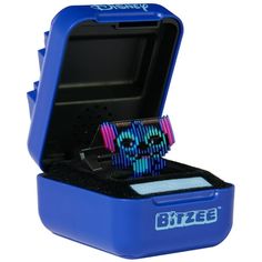 a blue box with some colorful items inside it and the lid opened to reveal an object