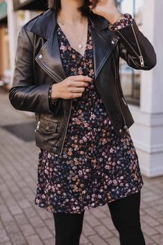 Fall Dress And Jacket Outfit, Fall Dress With Leather Jacket, Floral Mini Skirt Outfit Winter, Mini Floral Dress Outfit, Winter Wedding Guest Dress With Tights, How To Style Mini Dress In Winter, Floral Dress With Leather Jacket, Leather Jacket Outfits Women Dress, Floral Black Dress Outfit