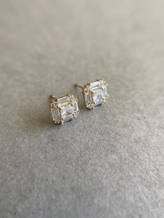 14K Solid Gold Square Baguette Setting Stud Earrings - 14K Solid Gold ★ Quantity: One Pair ★ Size : 7.2mm ★ Color :  Diamond/ Emerald / Sapphire / Ruby ★ Stone : Cubic Zirconia  (CZ) ★ Post : 9mm ★ Gauge : 22 Gauge ★ Color : Yellow Gold ★ Materials : 14K Solid Gold ★ Back : Gold Filled ★ Comes in a jewelry box. If you need extra boxes for gifting....just let us know! Ruby Stone, Screw Back Earrings, Gold Material, Solid Gold, Gold Filled, Screw, Jewelry Box, Cubic Zirconia, Ruby