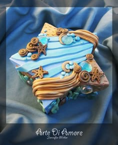 an image of a cake made to look like the shape of a boat with stars on it