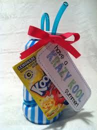 a blue and white striped gift bag filled with candy