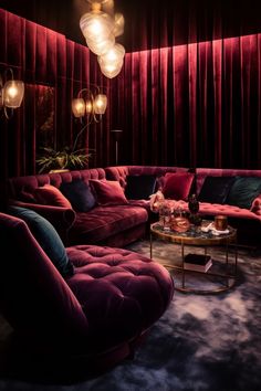 a living room filled with red couches and chairs next to a round coffee table