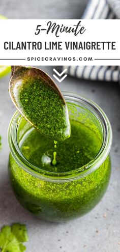 a spoon full of green liquid with the words 5 minute cilantro lime vinaigrete