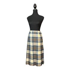 Excellent Condition Elevate your wardrobe with this timeless Vintage Aljean of Canada Wool Plaid Kilt Skirt. Crafted from pure virgin wool, this skirt features a traditional tartan plaid in soothing tones of blue, cream, and brown. The pleated design offers a structured yet flowing silhouette that embodies classic academia and preppy vibes. With side button closure and a wrap-around style, this skirt is as functional as it is stylish. Perfect for layering with cozy sweaters or a sharp blazer, th Classic Academia Aesthetic, Retro Plaid Lined Skirt Bottoms, Vintage Plaid Pleated Skirt, Vintage Brown Wool Skirt, Classic Academia, Pleated Skirt Pattern, 1970s Plaid Skirt, Vintage Plaid Cotton Skirt, Academia Style