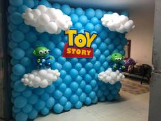 an inflatable toy story balloon wall with angry birds and clouds on it for display