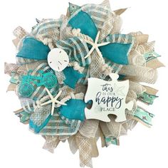 a blue and white wreath with words on it that says, this is your happy place